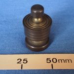 Brass coin pedestal