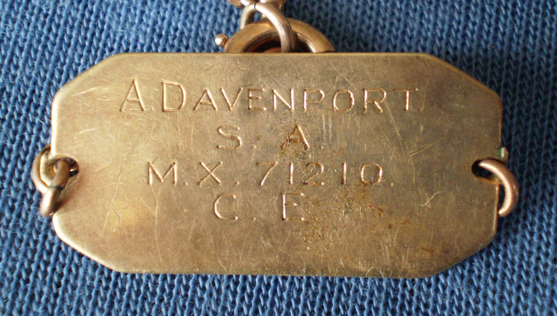 Gus Davenport metal identification plate during WW2