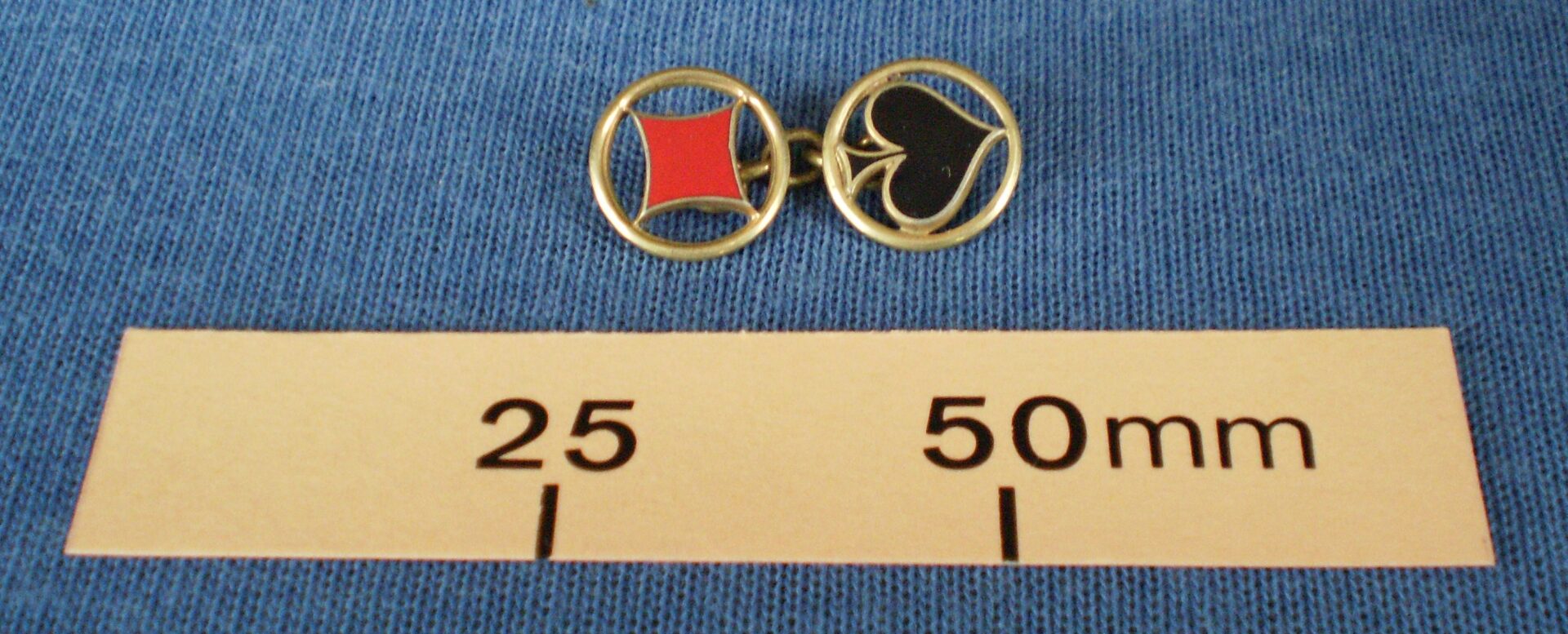 Single cufflink with diamond  & spade card motif