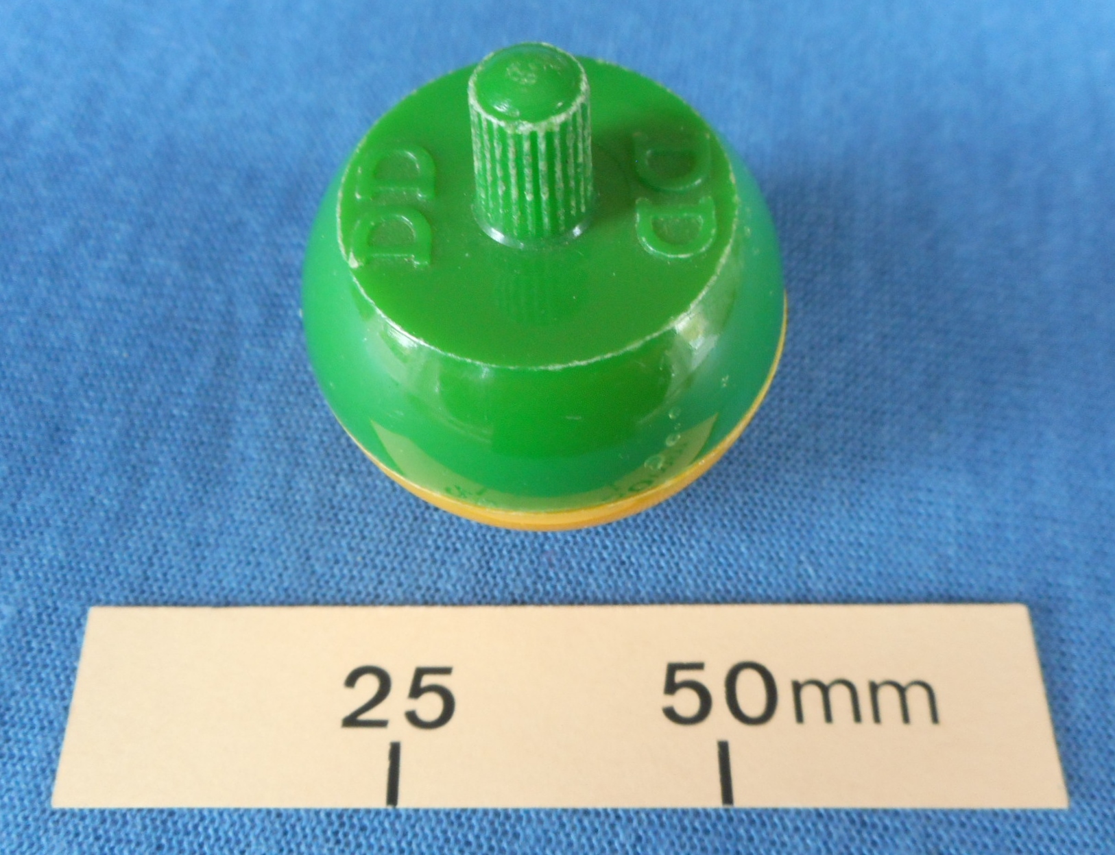 Plastic tippee top with DD on the top of it