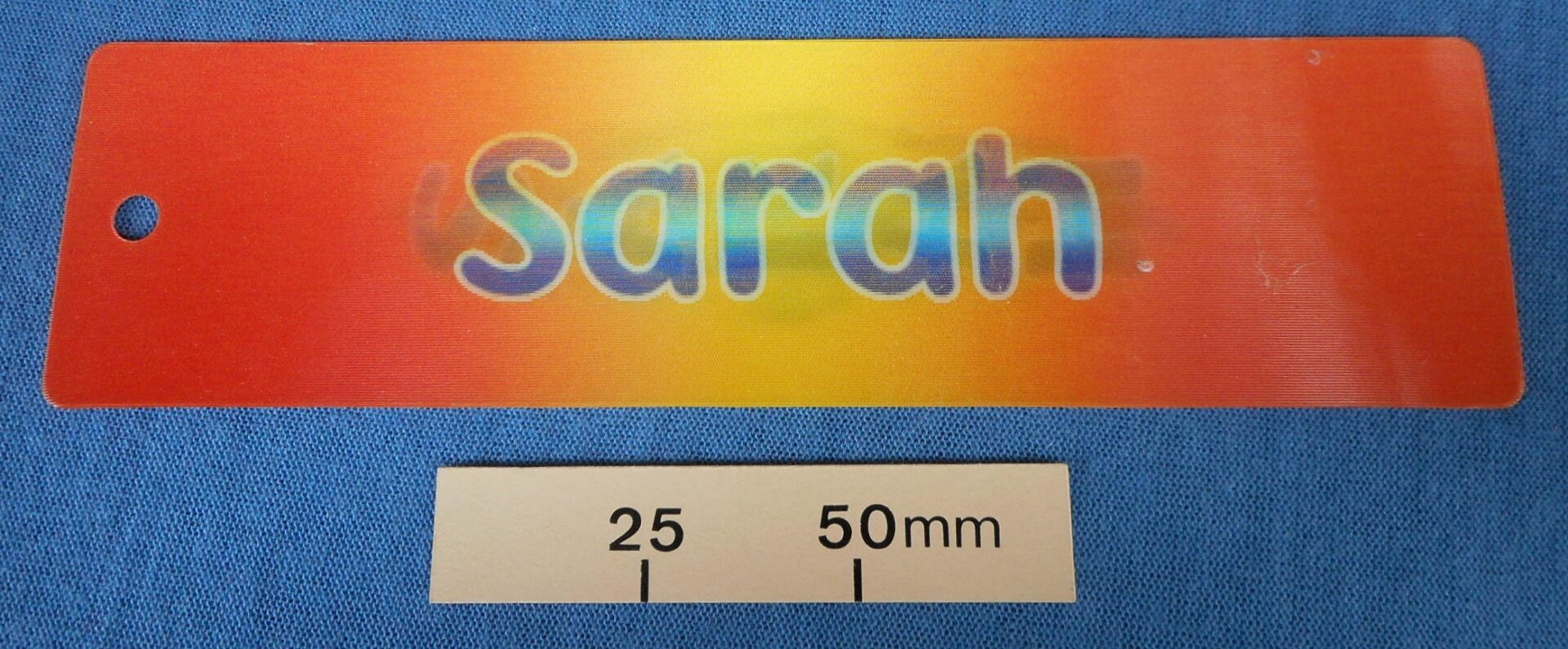 A lenticular that gradually morphs from the horizontal word Sarah to the vertical word SARAH