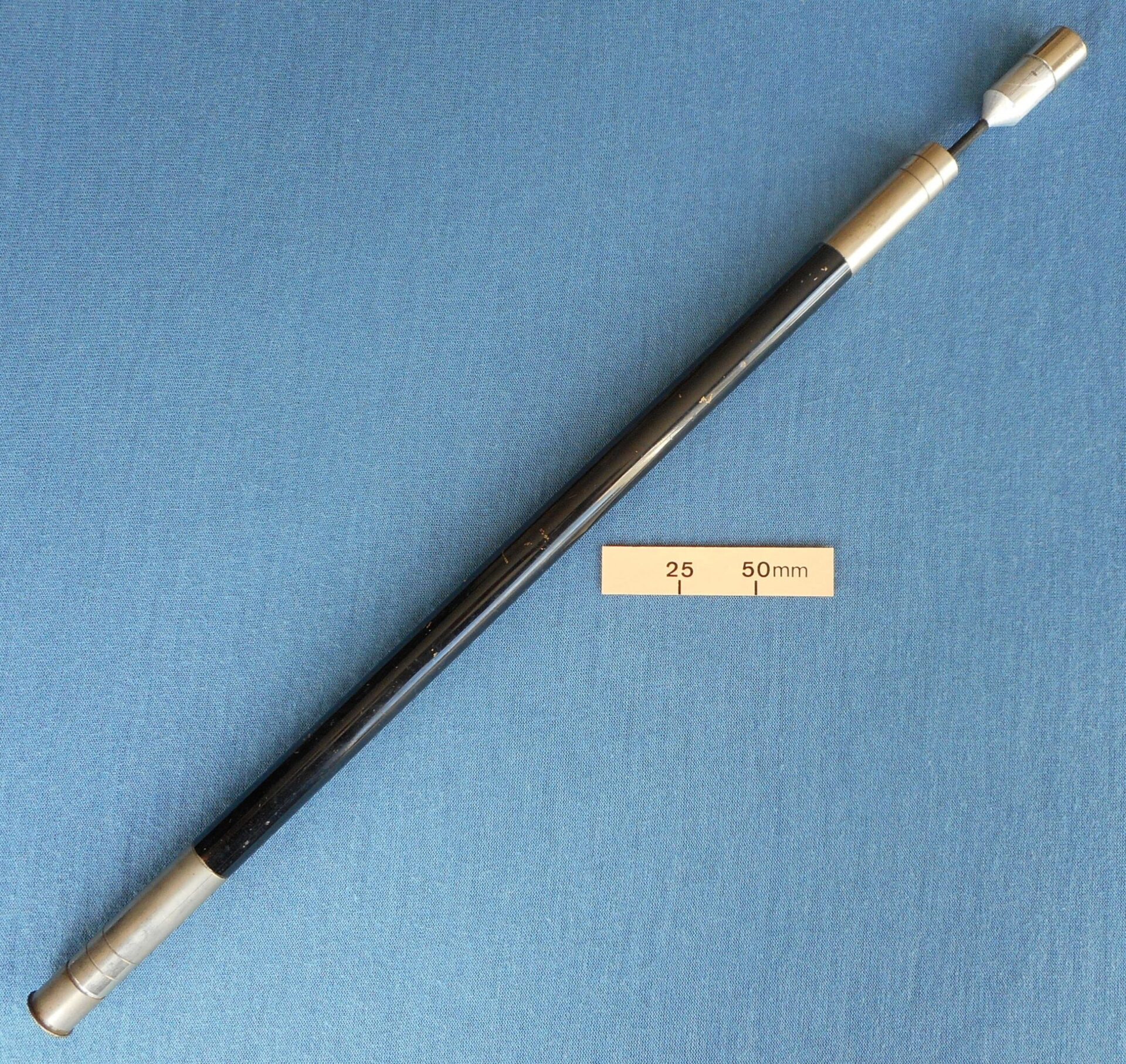 Wand for vanishing a silk from a paper cone
