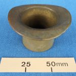 Ornamental brass top hat