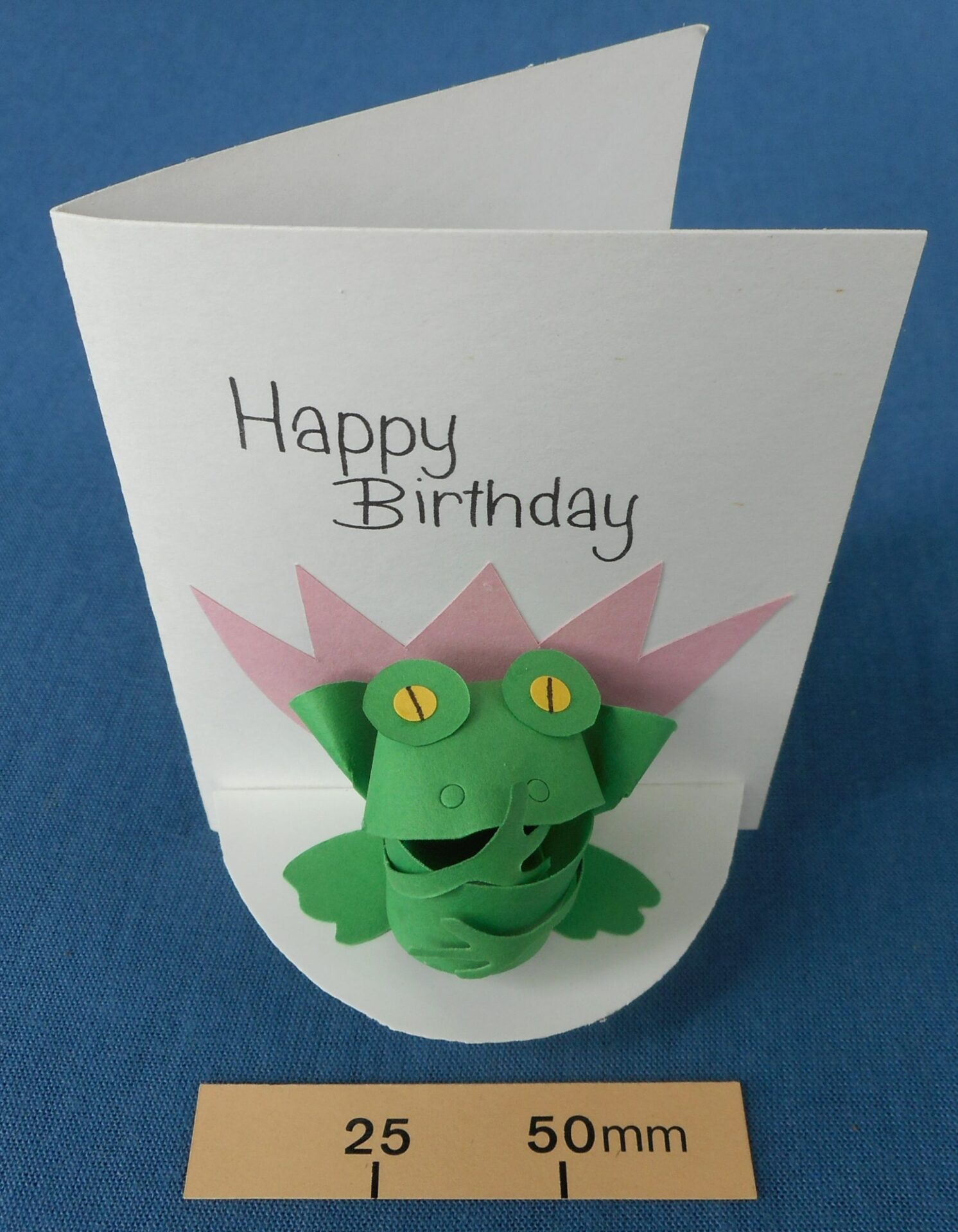 Card with a frog paper sculpture on the front