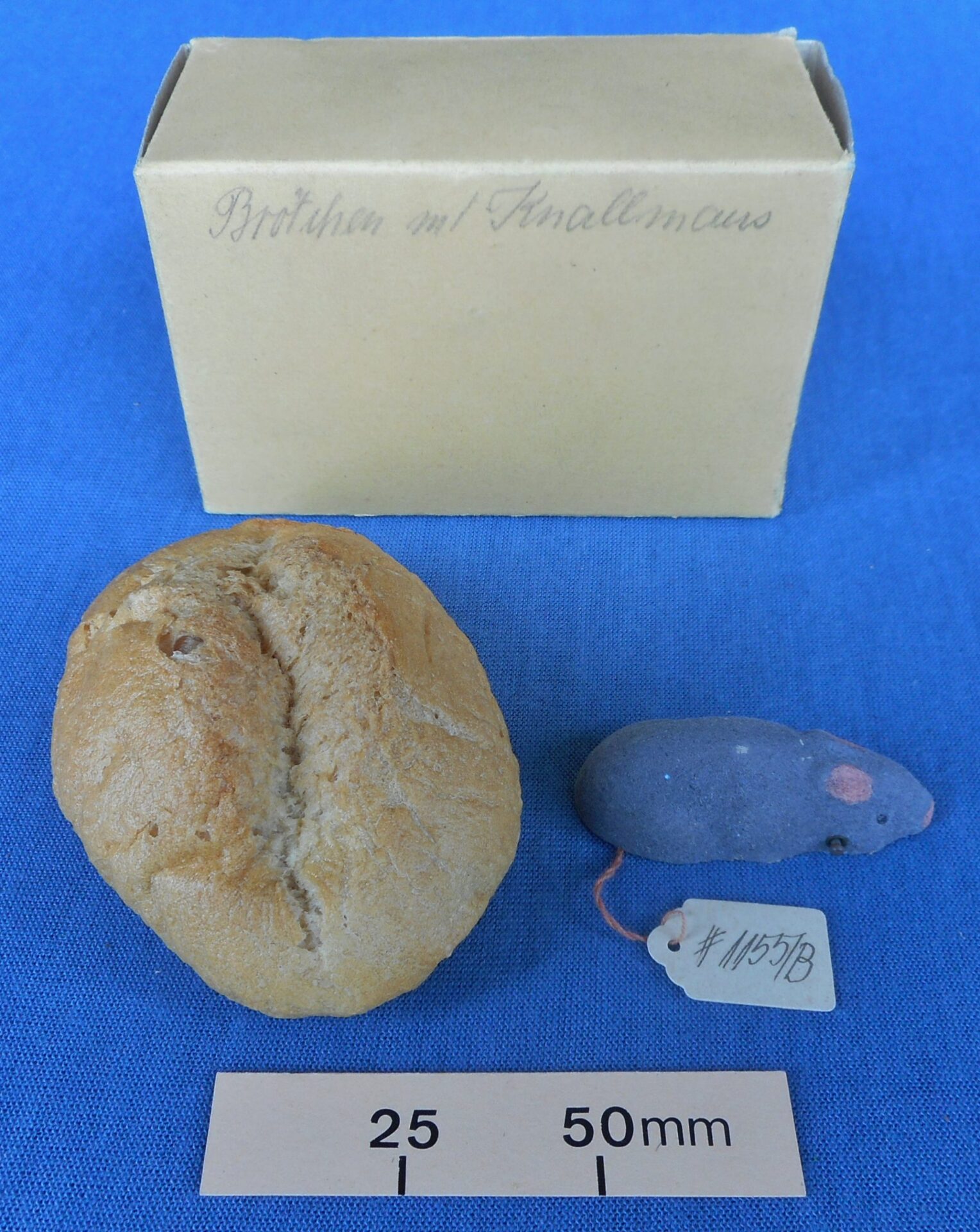 Joke bread roll with exploding mouse underneath