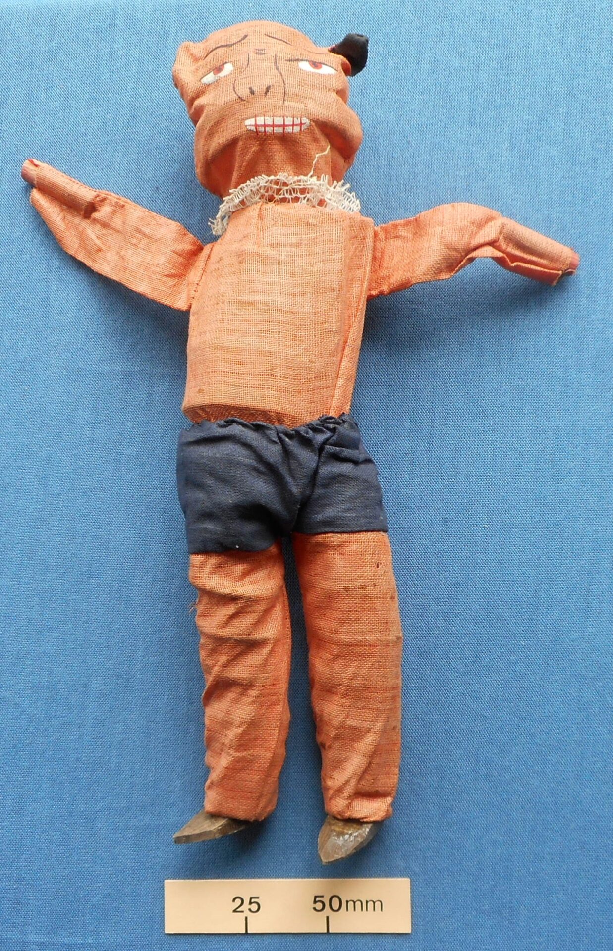 Collapsing cloth demon doll with springs inside