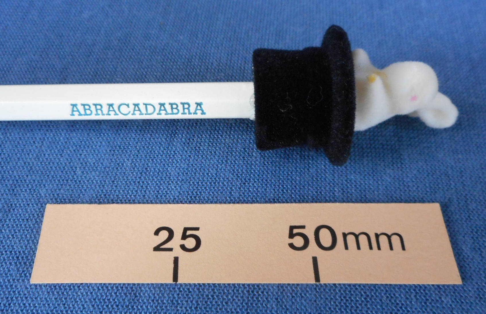 Novelty pencil with rabbit in a hat on the end