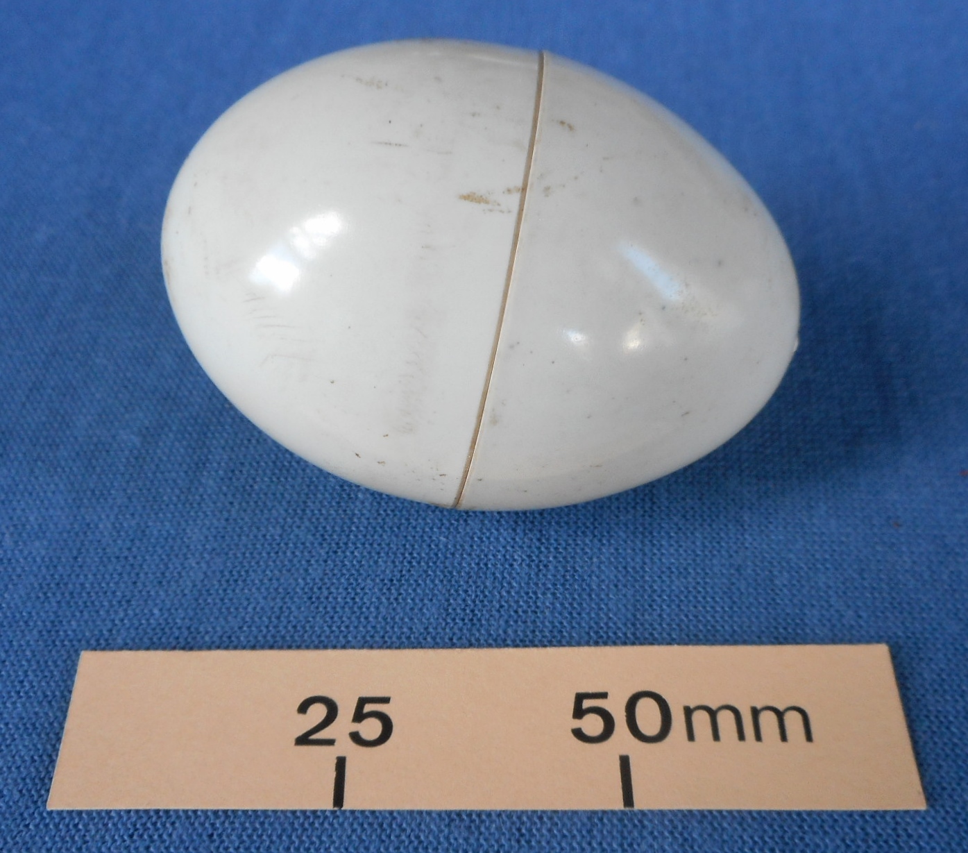 Plastic egg which converts into two egg cups