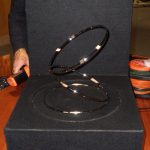 Optical illusion of three revolving rings on a turntable