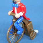 Plastic wind up man on penny farthing, made in China