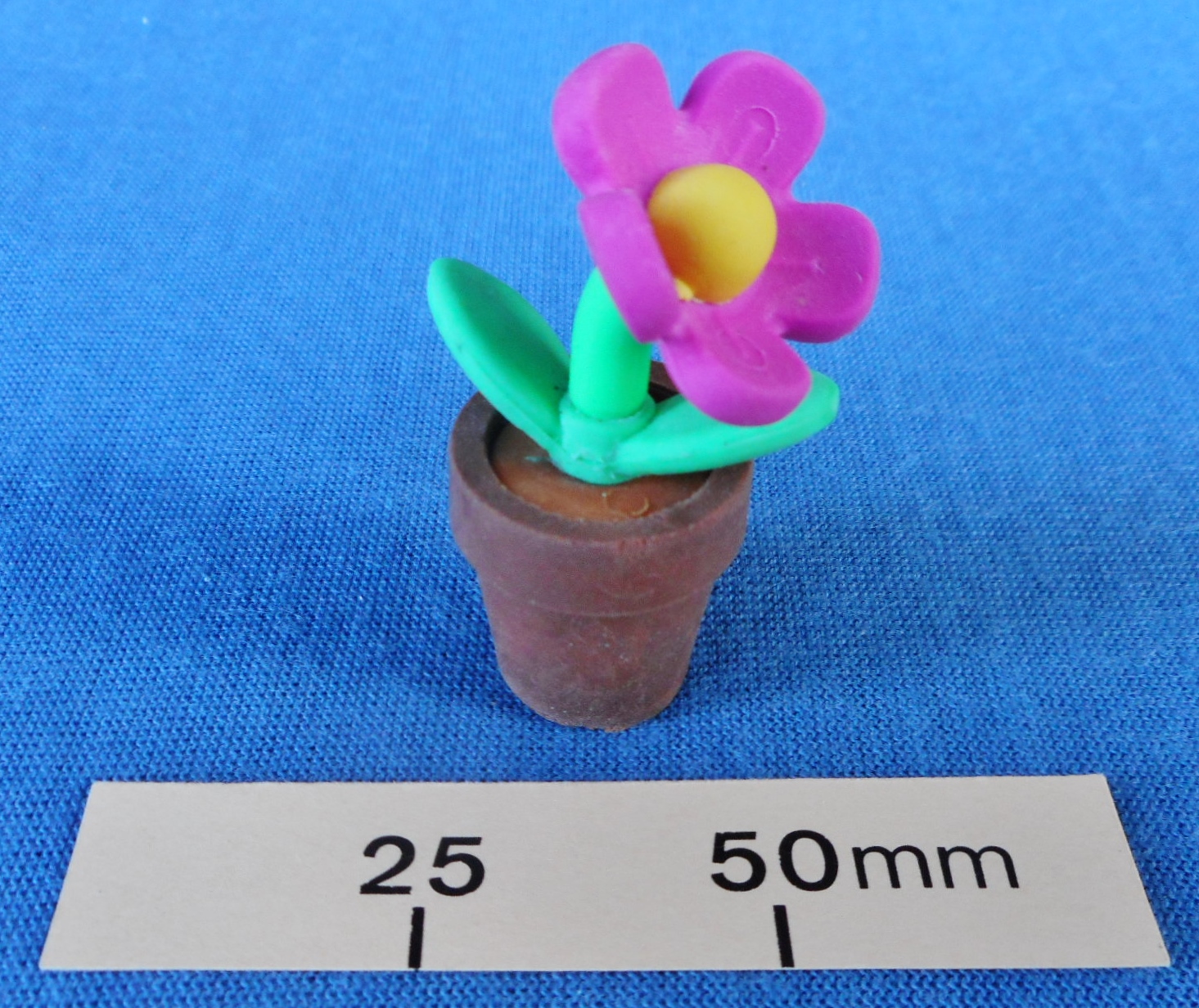 Novelty eraser in the shape of a flower in a flower pot