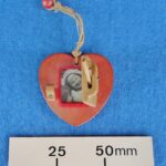 Heart shaped wooden locket with photograph