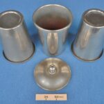Unknown trick with three nickel plated canisters
