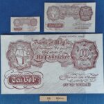 Three sizes of red ‘Half a Knicker’ stage money